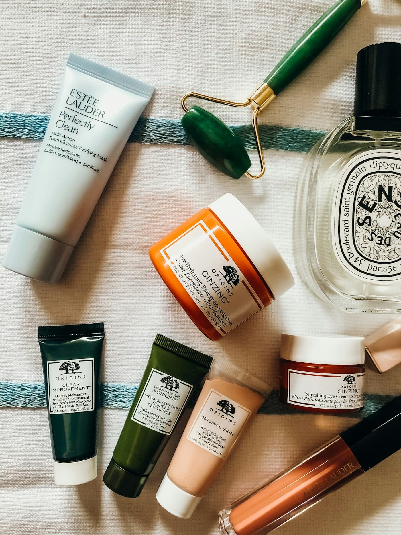 Full skincare shelf flat-lay with jade roller