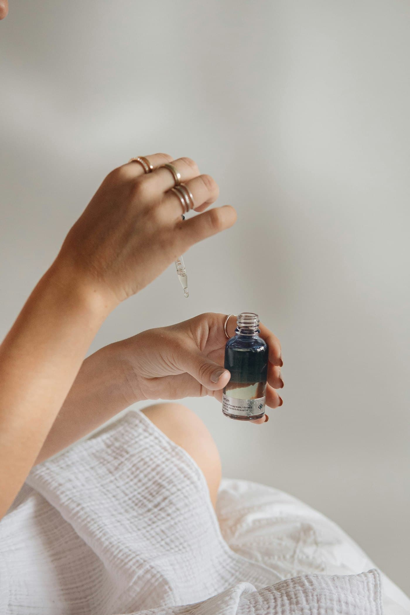 Applying a treatment serum to the hand